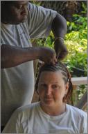 Olga braiding Gina's hair