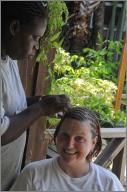 Olga braiding Gina's hair