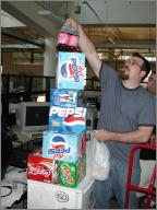 Ray builds a tower of drinks