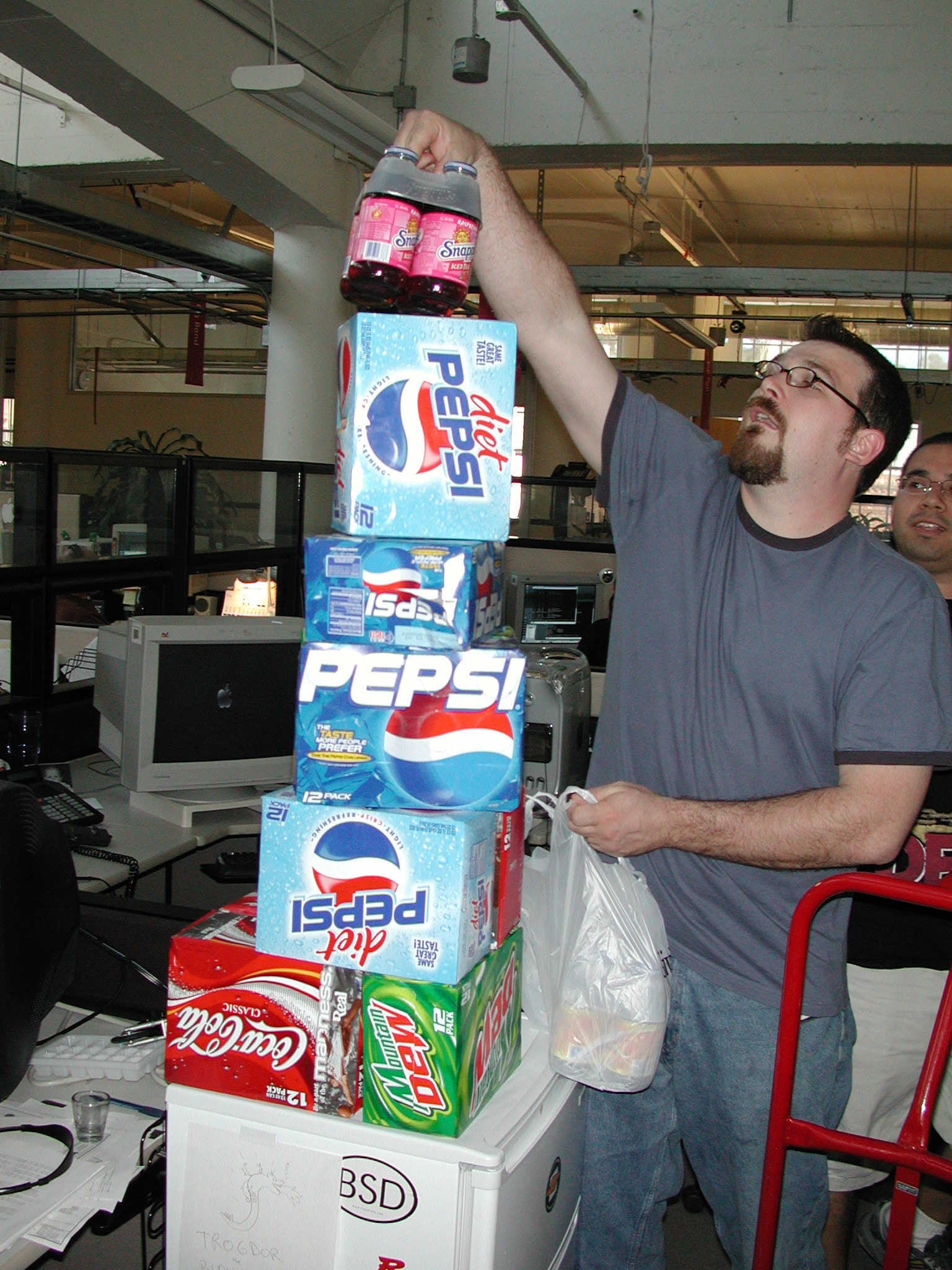Ray builds a tower of drinks